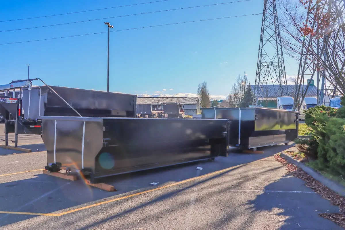 Roll-off dumpster ready for waste disposal at job site for Roofing Dumpster Rental in Pembroke